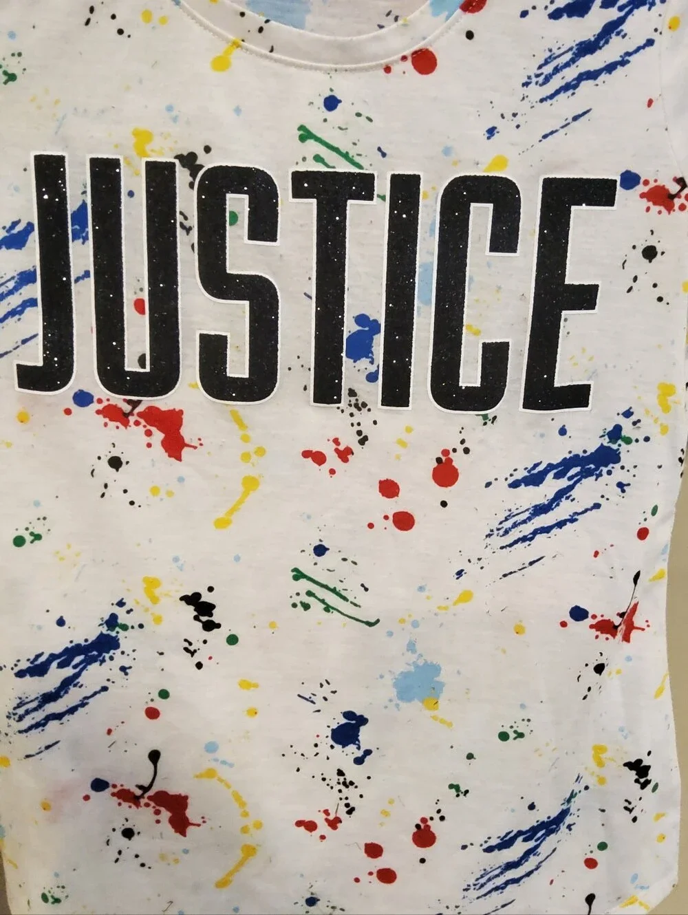 Justice White Graphic Tee with Multicolor Paint Splatter